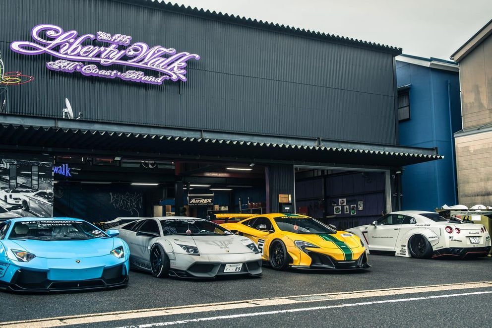 Liberty Walk workshop, wide-body supercars outside