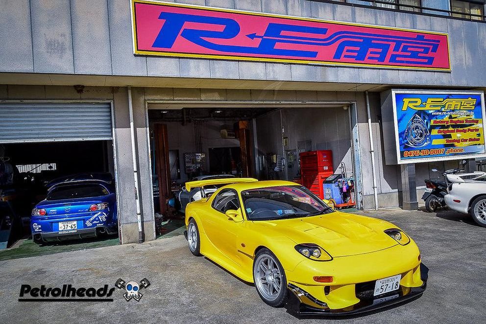 An RE Amemiya RX-7 outside the workshop