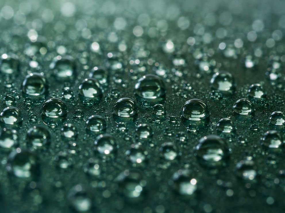 Water standing in tight beads on a protected surface