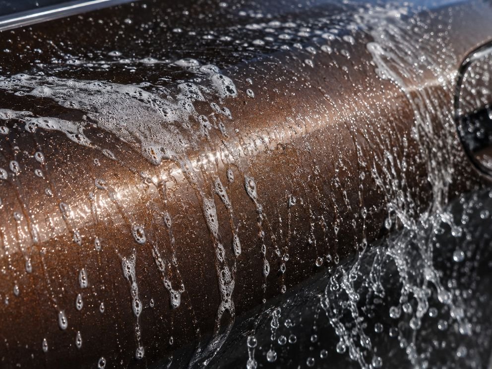 A protected panel beaded with road spray and cleaning solution